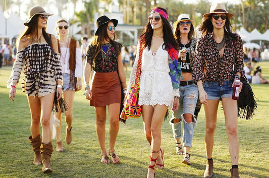 Stylish festival scene with boho dresses, crop tops, bold prints, and colorful accessories, set in a lively outdoor festival atmosphere.