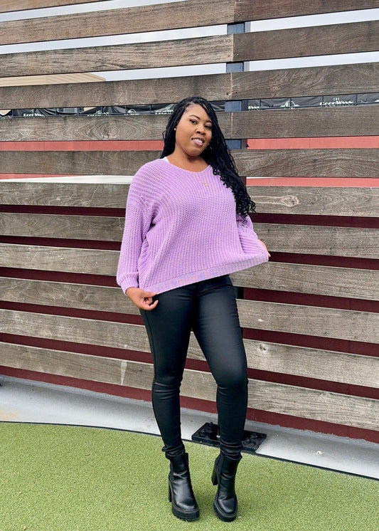 Oversized v-neck sweater worn off the shoulder. Model is 5'2, 150 lbs, wearing size Medium.